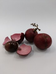 red longan, kelengkeng merah, dragon eye fruit. closeup. isolated on white background