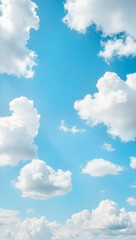Fototapeta premium Fluffy clouds floating in deep blue sky, dreamy summer vibes