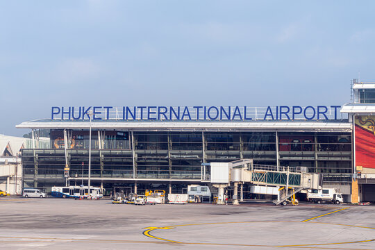 Phuket Airport. View of the Phuket International Airport building during the day from the runway after the plane lands.