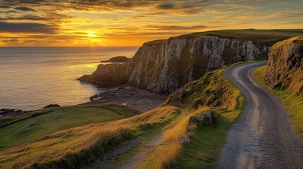 Coastal road winding along dramatic cliffs at sunset.