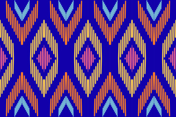 Ethnic Zigzag Diamond Pattern in Blue, Orange, and Yellow &ndash; Seamless Decorative Print