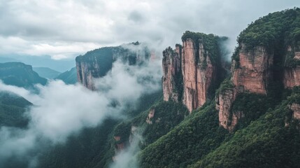 Majestic mountain cliffs veiled in mist and lush greenery offer a serene panorama