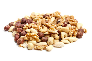 A delicious and nutritious nut assortment featuring walnuts, almonds, cashews, and hazelnuts on a white surface. Ideal for snacking or recipes