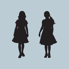 Silhouette of Two Young Girls in Dresses