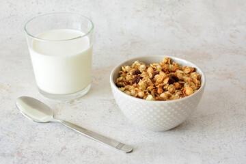 Breakfast cereal with milk and spoon on the table