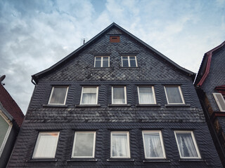 Traditional german house with wooden facade. Old timbered house in the old town. 