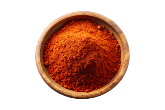 Red ground paprika spice powder in a wooden bowl, a hot cooking ingredient