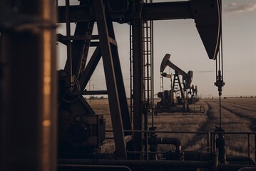 Oil Rig in the Vast Open Field at Twilight. High quality photo