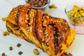 Swirls of rich chocolate weave through layers of buttery, golden dough—this is Babka at its finest. A decadent fusion of Eastern European tradition and artisanal baking, each slice offers a perfect ba