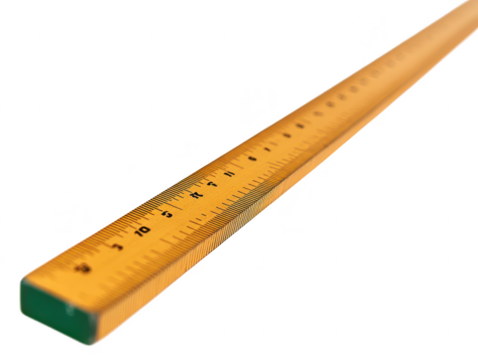 Close-up of a wooden ruler with clear measurement markings on a white background, showcasing craftsmanship and precision in educational tools