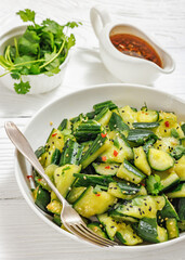 Japanese smashed cucumber salad in a white bowl