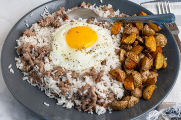fried egg with  rice  and crumble sausage