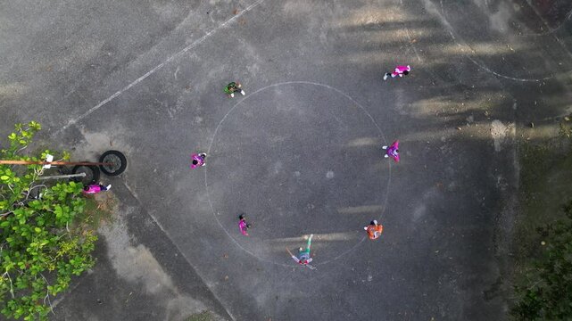 People playing on a sports field. Drone video. Sepak Takraw game 