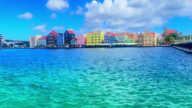 Colorful cityscape of Willemstad, Curacao island, featuring vibrant Dutch colonial architecture, a scenic waterfront, and a lively and relaxed Caribbean atmosphere