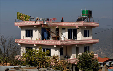  building being lived in but still under construction on a hillside