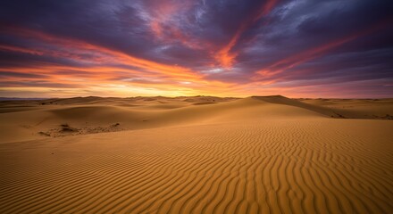 Desert Dunes at Sunset with Dramatic Sky and Orange and Purple Colors