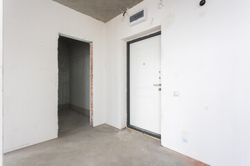 interior of the apartment without decoration in gray colors. rough finish