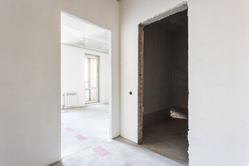 interior of the apartment without decoration in gray colors. rough finish