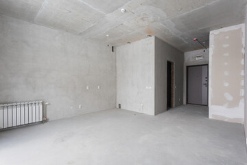 interior of the apartment without decoration in gray colors. rough finish
