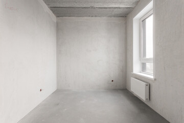 interior of the apartment without decoration in gray colors. rough finish