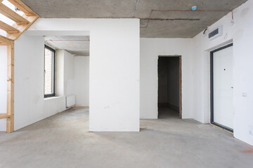 interior of the apartment without decoration in gray colors. rough finish
