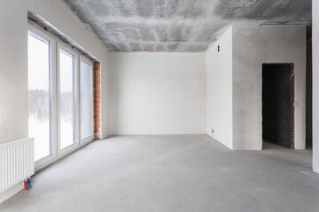 interior of the apartment without decoration in gray colors. rough finish