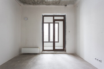 interior of the apartment without decoration in gray colors. rough finish