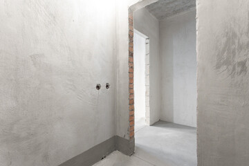 interior of the apartment without decoration in gray colors. rough finish
