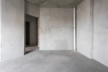 interior of the apartment without decoration in gray colors. rough finish