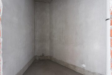interior of the apartment without decoration in gray colors. rough finish
