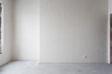 interior of the apartment without decoration in gray colors. rough finish