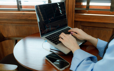A female investor analyzes past trends, sets goals, diversifies assets, and manages risks to ensure...