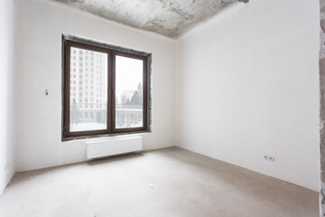 interior of the apartment without decoration in gray colors. rough finish