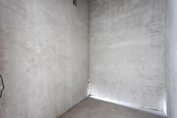 interior of the apartment without decoration in gray colors. rough finish