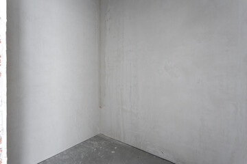 interior of the apartment without decoration in gray colors. rough finish