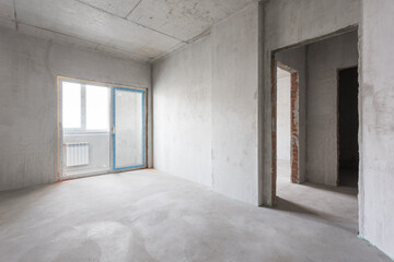 interior of the apartment without decoration in gray colors. rough finish