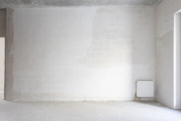 interior of the apartment without decoration in gray colors. rough finish