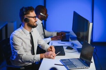 Happy Confident Technical Customer Support Specialist Having a Headset Call in a Monitoring and...