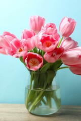 Beautiful bouquet of pink tulips in the vase on the table