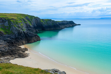Obraz premium Serene coastal view of rocky cliffs and calm turquoise waters