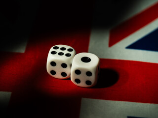Gambling dices on the Union Jack Flag