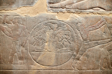 A wall scene from the mastaba of Mereruka in Saqqara showing a music scene with two men clapping...