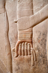 Woman holding man's hand in sign of affection form the wall of Mereruka tomb, Saqqara, Egypt