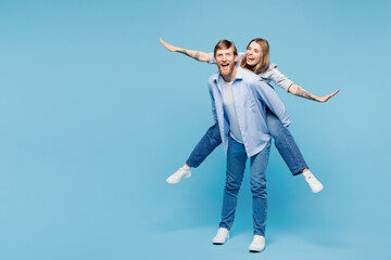 Full body young happy couple two friends family man woman wear shirt casual clothes together giving...
