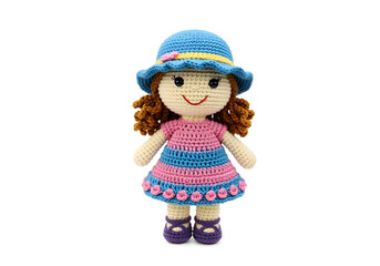 Handmade Crochet Girl Doll isolated on a white background.