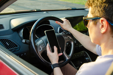 woman Driver Using Smartphone While Steering the Car