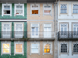 Close-up of traditional ceramic tile covered facades of residential apartment buildings in Braga in...