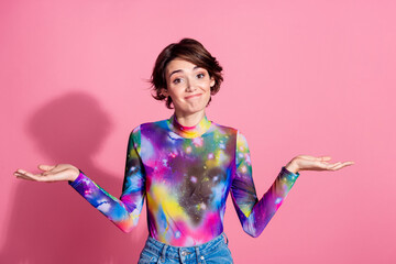 Portrait of pretty young girl shrug shoulders wear pullover isolated on pink color background