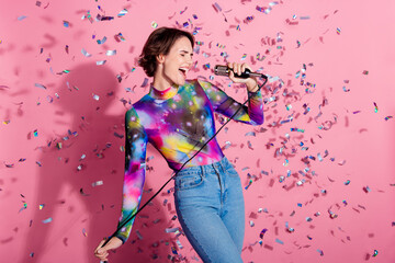 Photo of nice young woman singing wear pullover isolated on pink color background