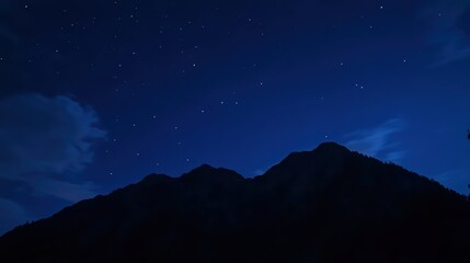 Naklejka premium Stunning night landscape featuring the bright Milky Way galaxy over majestic mountains. A breathtaking starry sky perfect for nature, astronomy, and adventure themes.